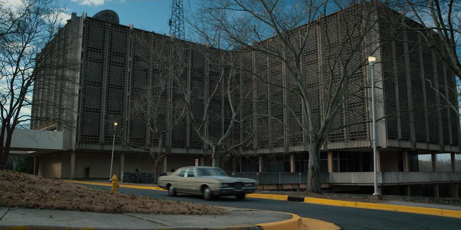 Nancy and Jonathan drive away from the lab.