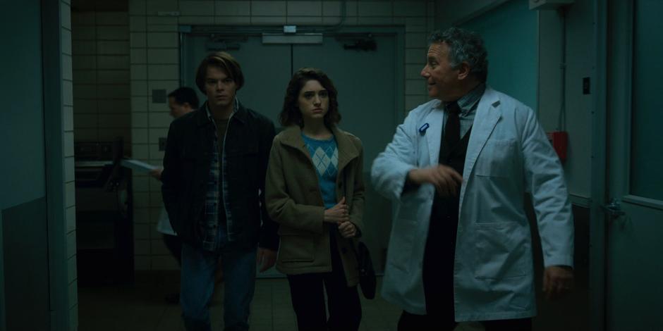 Dr. Owens escorts Nancy and Jonathan through the lower level of the building.