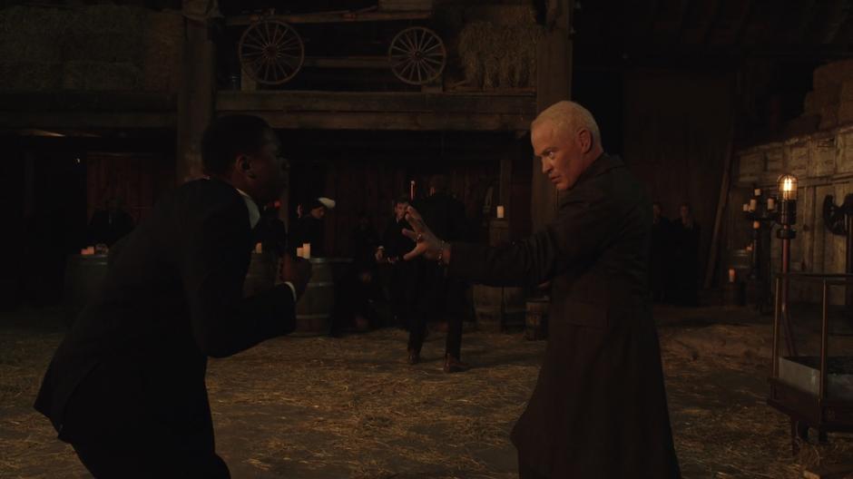 Darhk uses his new powers to choke a Time Bureau agent.