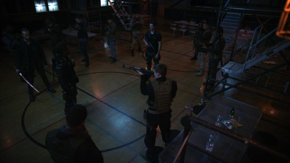 Slade talks with Joseph while surrounded by the Jackals.