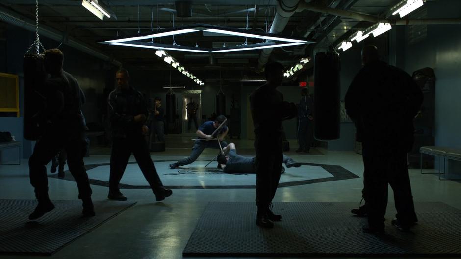 Joseph and Slade spare in the middle of the facility.