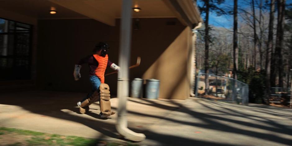 Dustin runs outside in heavy padding after leaving a trail for Dart to follow.