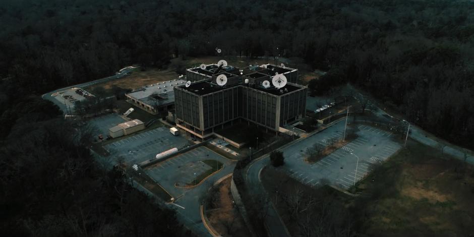 Wide aerial establishing shot of the lab during the daytime.