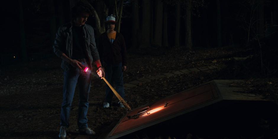 Dustin shows Steve the cellar.