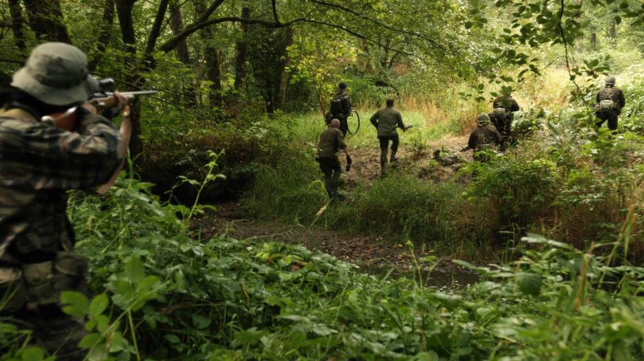 Mick, Nate, and the soldiers form up to face off against the coming soldiers.