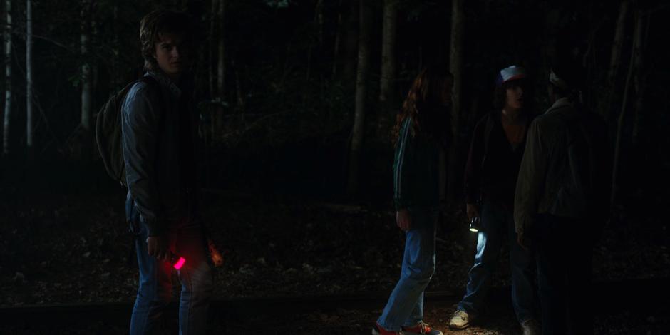 Steve notices something off in the woods while Max, Dustin, and Lucas argue.