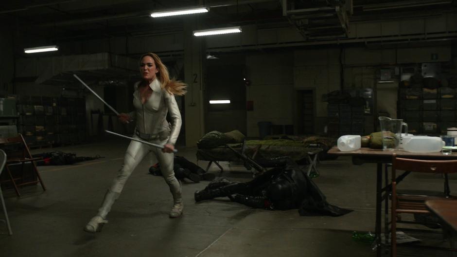 Sara runs after defeating several Earth-X soldiers.