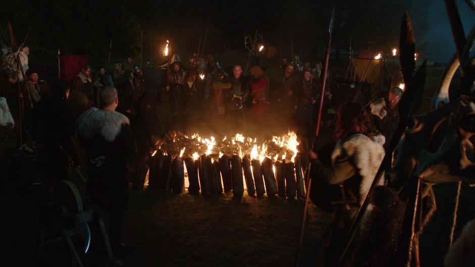 The Vikings prepare to throw Mick onto a pyre.