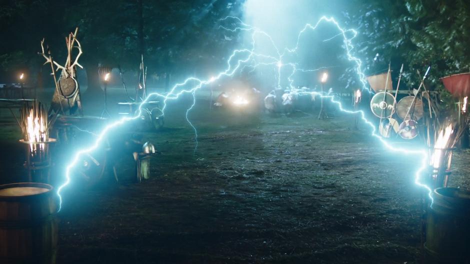Darhk stoots out lightning around the field while posing as Thor.