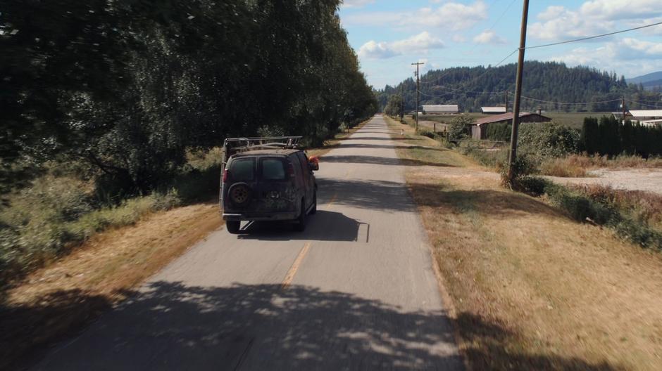 The Rowdy Three's van drives off down the highway while the Beast leans her head out the window.