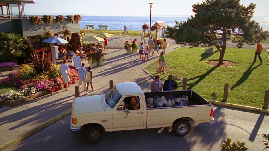 Shawn and Gus talk as Henry drives off in his truck.