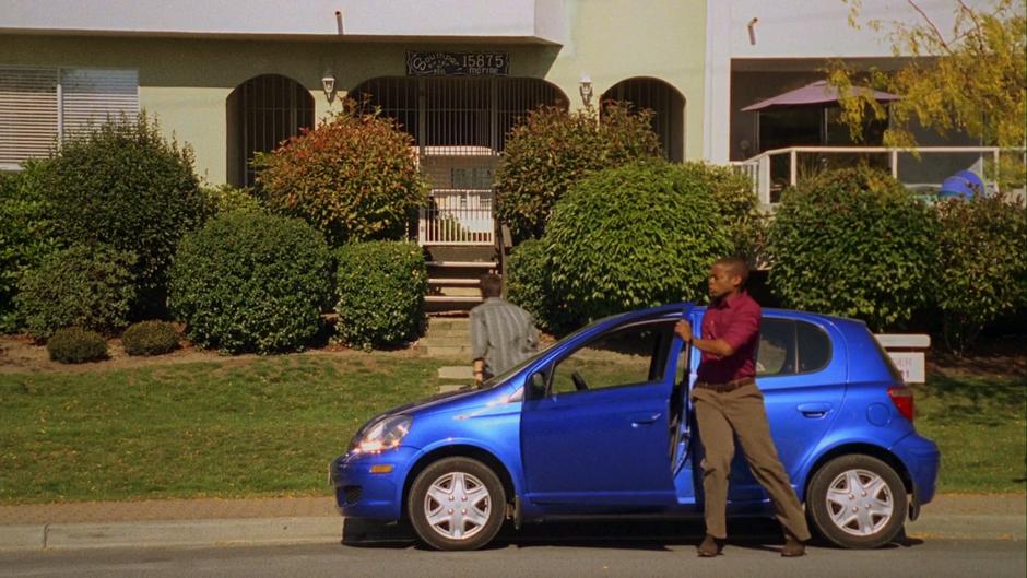 Shawn walks up to the front door as Gus gets out of the Blueberry.