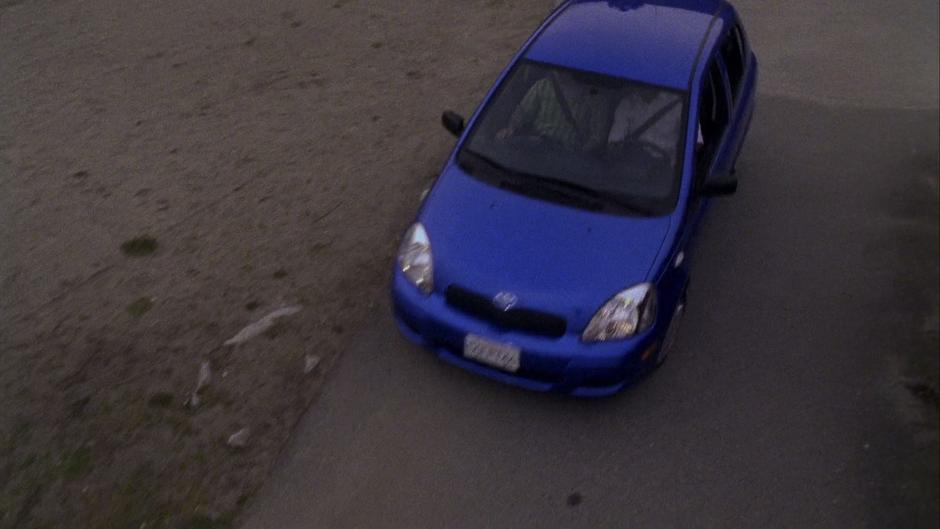 Gus and Shawn drive down the path in the Blueberry.