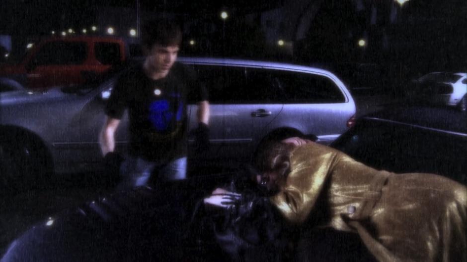 Bevin Rennie Llywellen steals from Emilina Saffron's purse as she is passed out on a car.