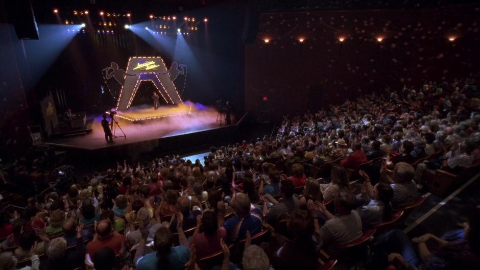 The audience listens to Shawn's performance.