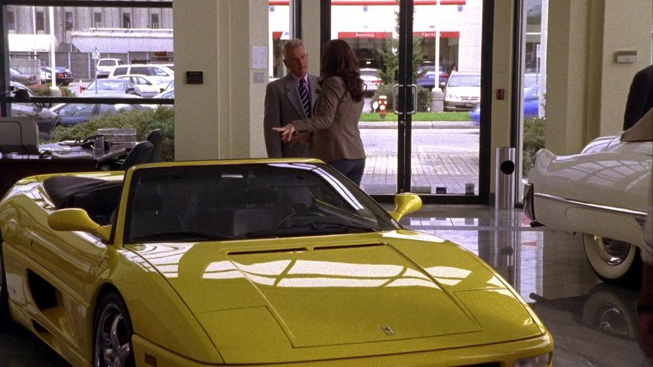 Lindsay Leikin talks to one of the salespeople in in the dealership.