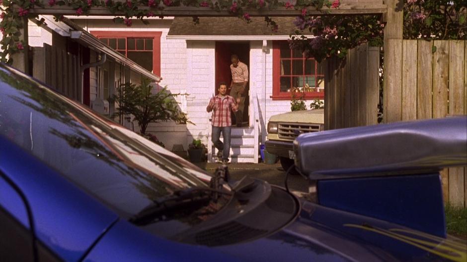 Shawn and Gus walk to the Blueberry parked in the alley.