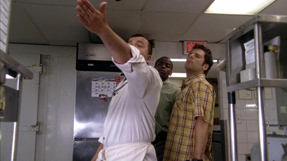 Antonio gives Gus and Shawn a tour of the kitchen as they pose as health inspectors.