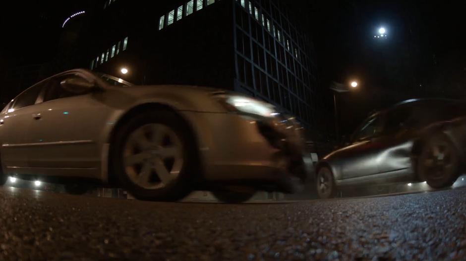 The pursuing driver crashes into another car in the middle of the intersection.