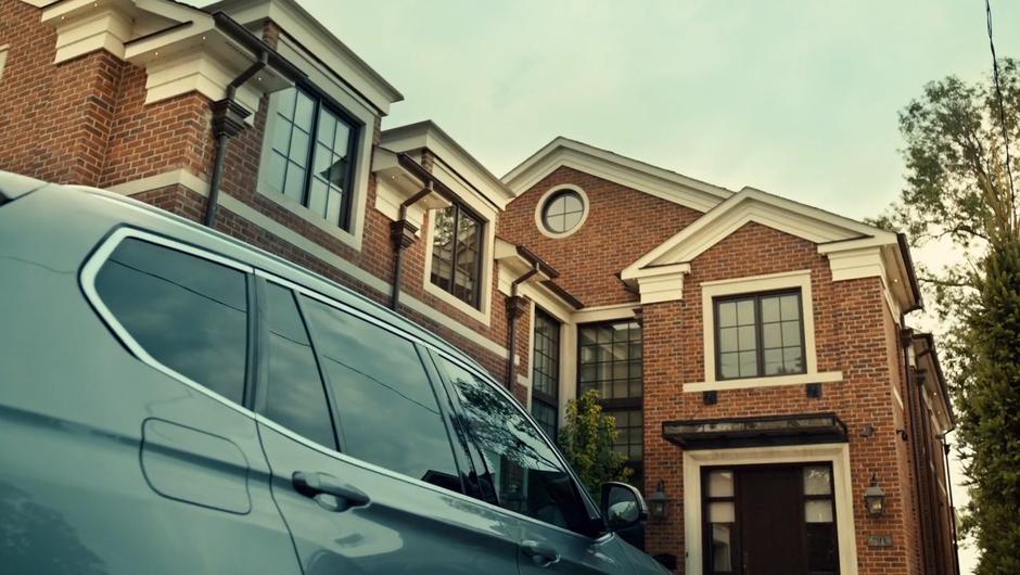 Establishing shot of the front of the house with Mary's car sitting in the driveway.