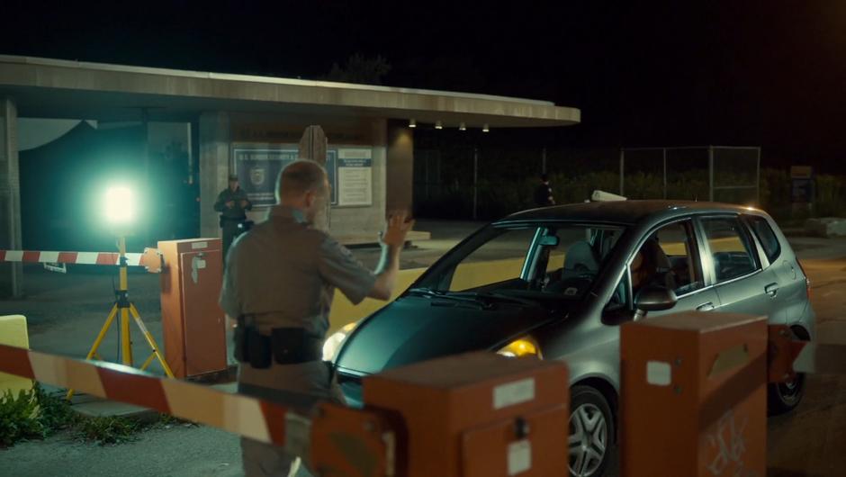 The border crossing guards stop Mary at the checkpoint.