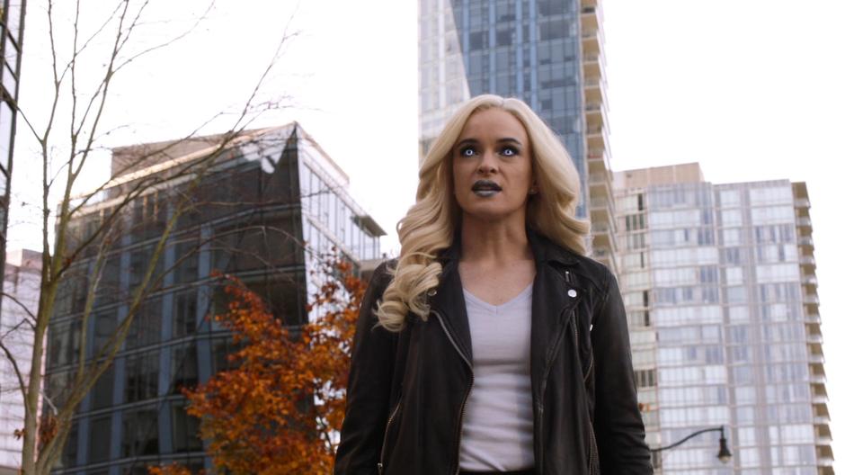 Caitlin in full on Killer Frost mode walks up to Neil Borman.