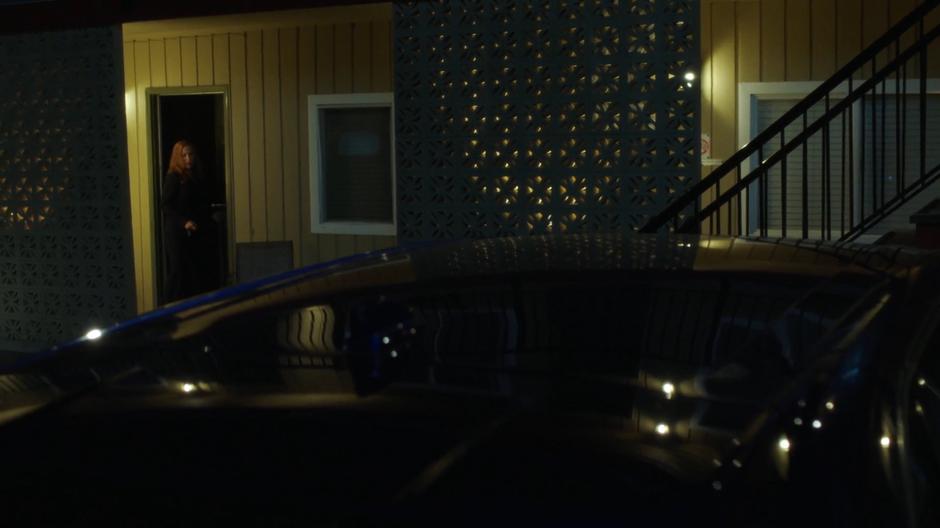 Scully leaves her room and walks over to her car.