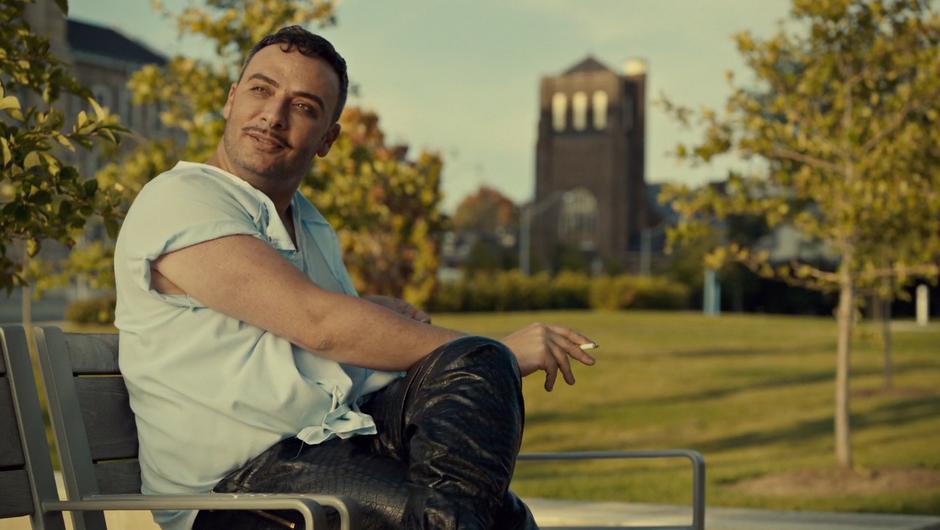 Brendan looks up at Mary while sitting on a bench outside the hospital.