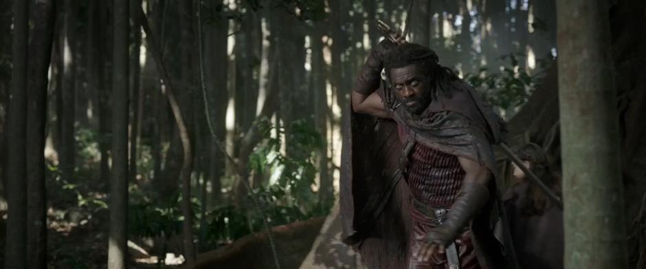 Heimdall pulls out his sword to defend the refugees who are taking shelter behind him.