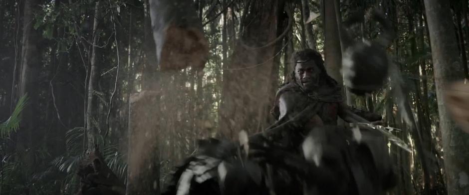 Heimdall cuts through a tree while decapitating one of Hela's soldiers.