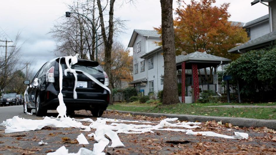 Councilman Grovner drives off trailing toilet paper.