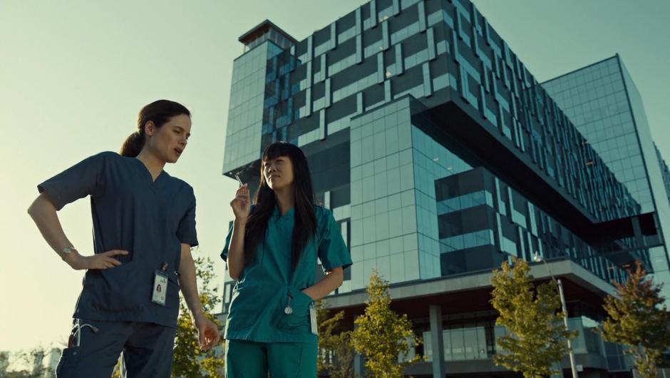 Mary and Annie chat while smoking across the street from the hospital.