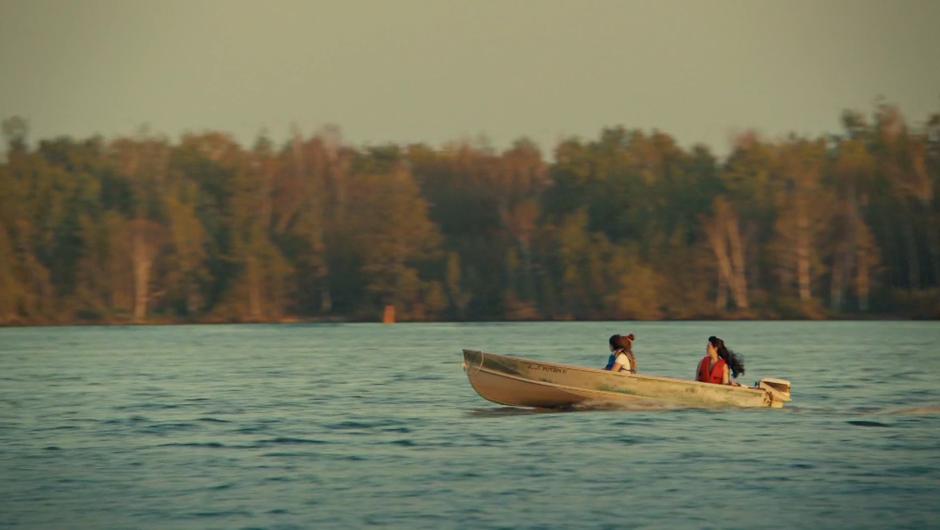 Jess, Naomi, and Nicole head down the lake in the boat.