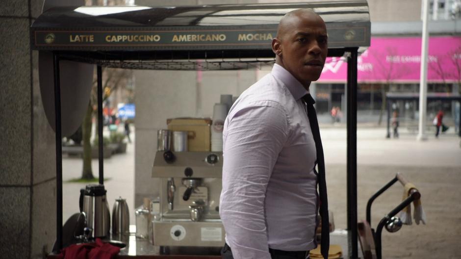 James look around after finding the coffee stand empty.