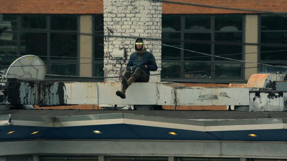 Micro stands up from his perch on the vents atop the diner.