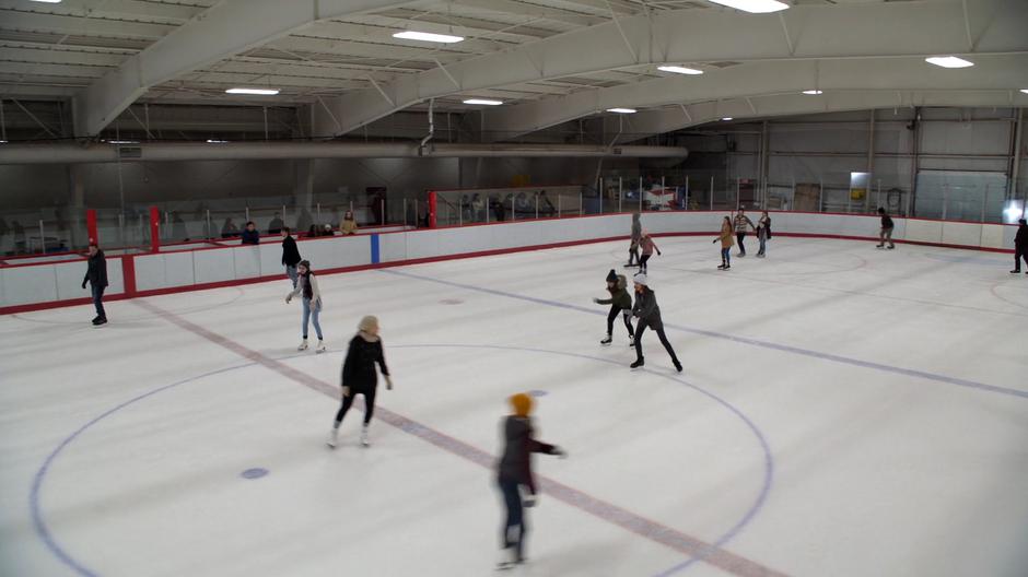 Ruby and Sam race down the rink.