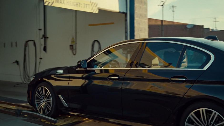 Olivia drives her car into the car wash with Mary.