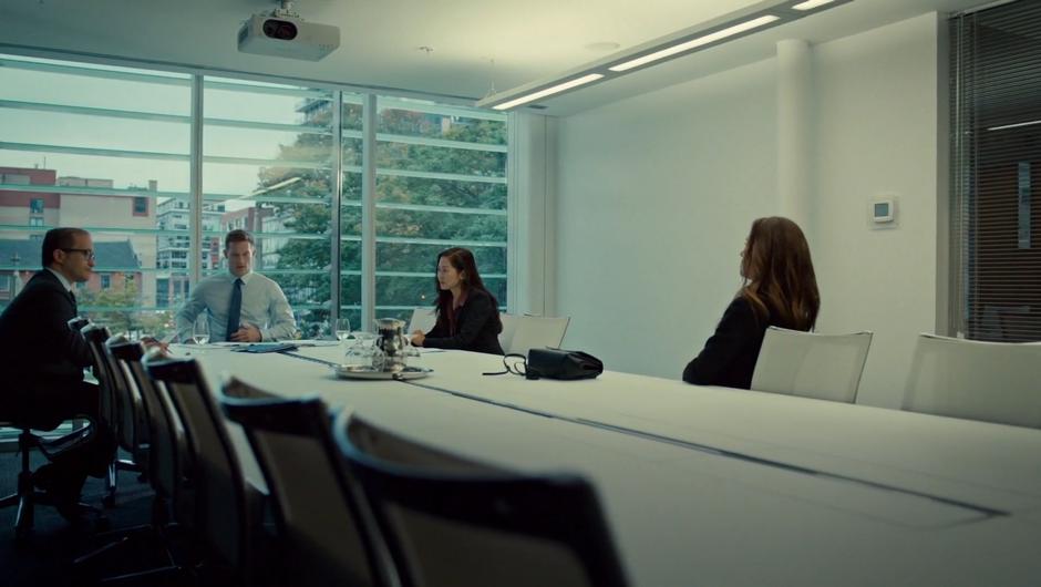 Mary and Dr. Dunn sit down at the conference table with the hospital's lawyers.