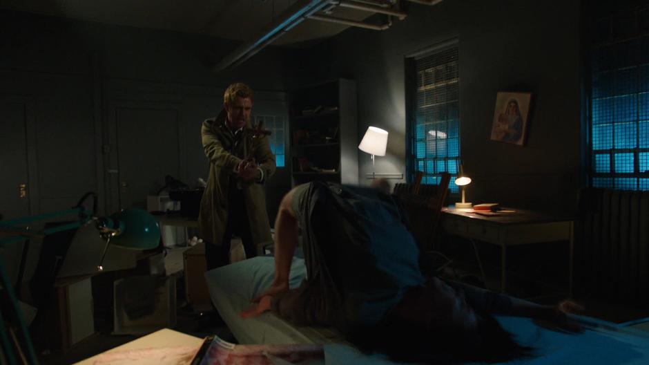 Constantine attempts to exorcise Nora Darhk.