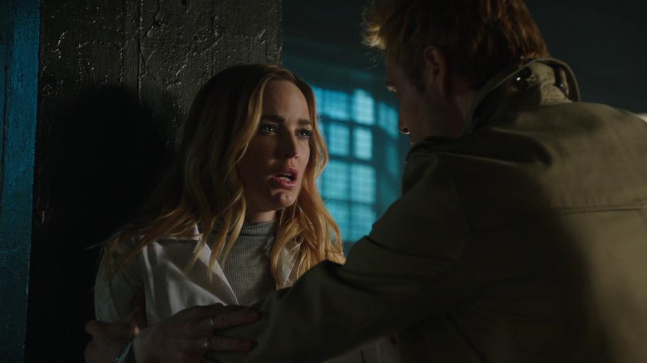 Constantine tries to calm down Sara in the laundry room.