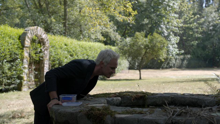 Blaine yells down into the well at his father.