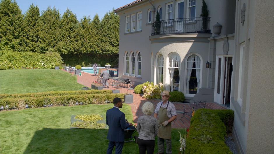 Clive and Liv talks to the gardener behind the house.