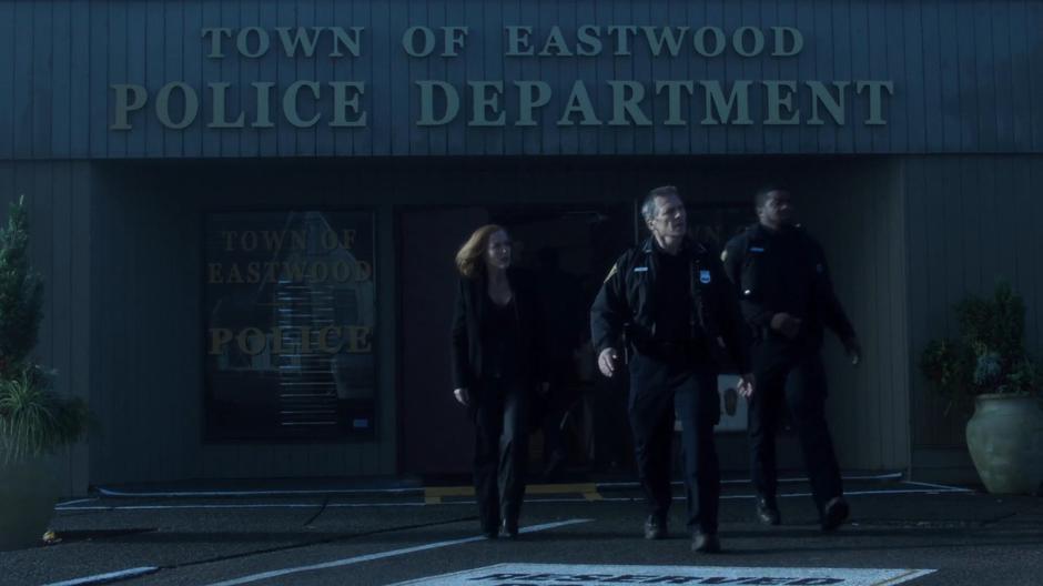 Scully, Chief Strong, and Officer Wentworth run out of the building looking for Eggers.