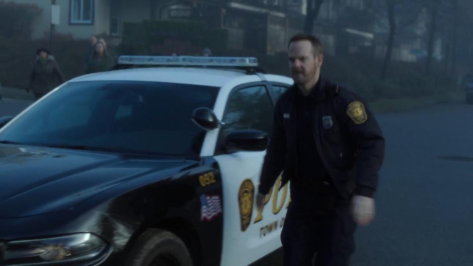 Officer Eggers gets out of his squad car after ramming into Melvin Peter.