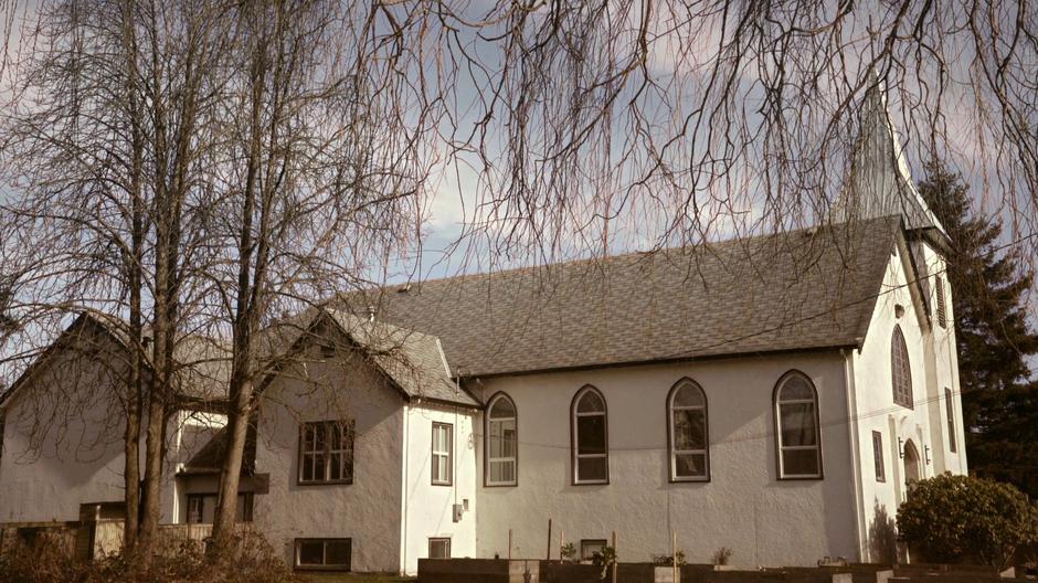 Daytime establishing shot of the church.