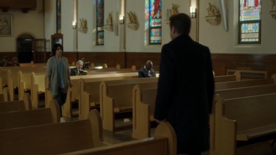 Mulder walks down the aisle while Juliet Bocanegra walks up to the priest.