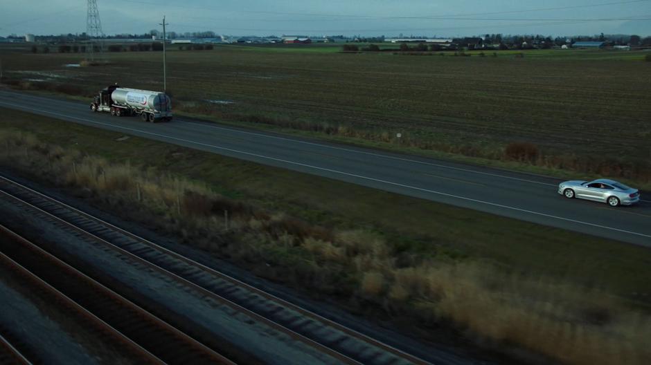Mulder speeds up behind the truck where William hitched a ride.