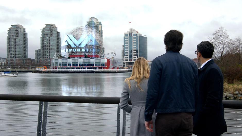 Sara, Ray, and Gary look across the water as the Ava Corporation headquarters.