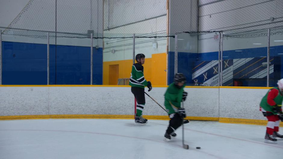 Levon Patch watches several young kids skate past.