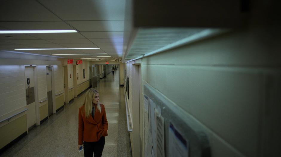 Trish waits outside the morgue for Jessica's signal.